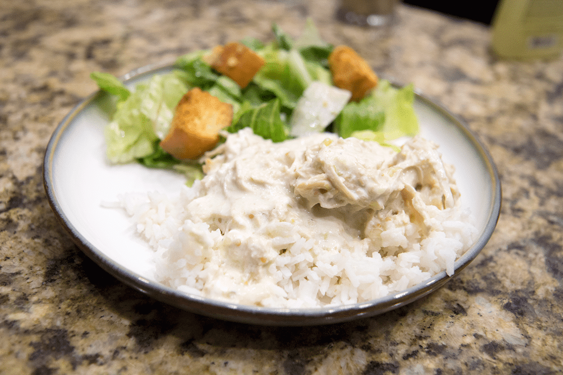 Salsa verde chicken on a dinner plate. 