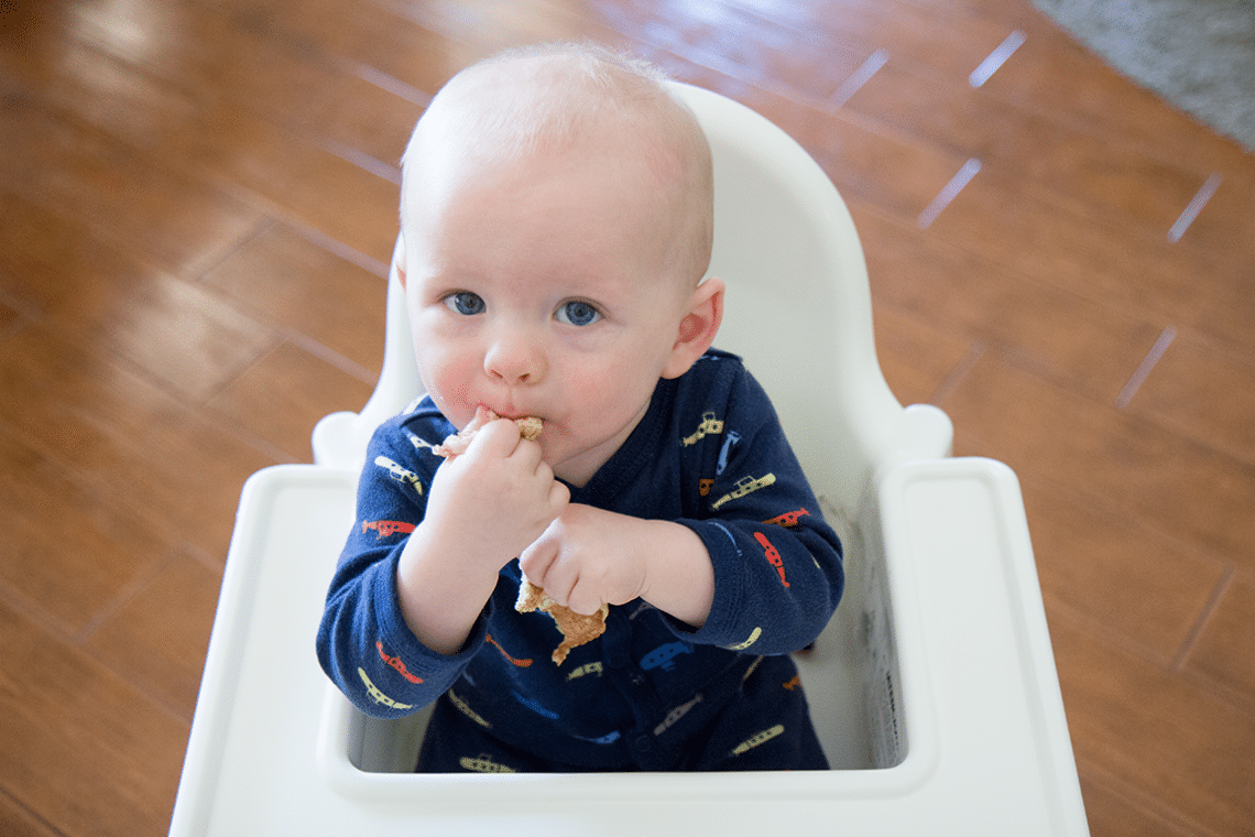 Baby eating oatmeal buttermlik pancakes. 