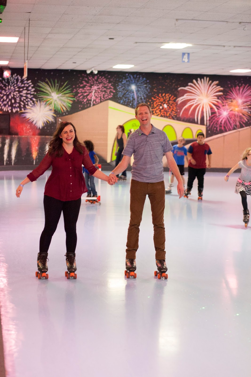 Holding hands roller skating date.  