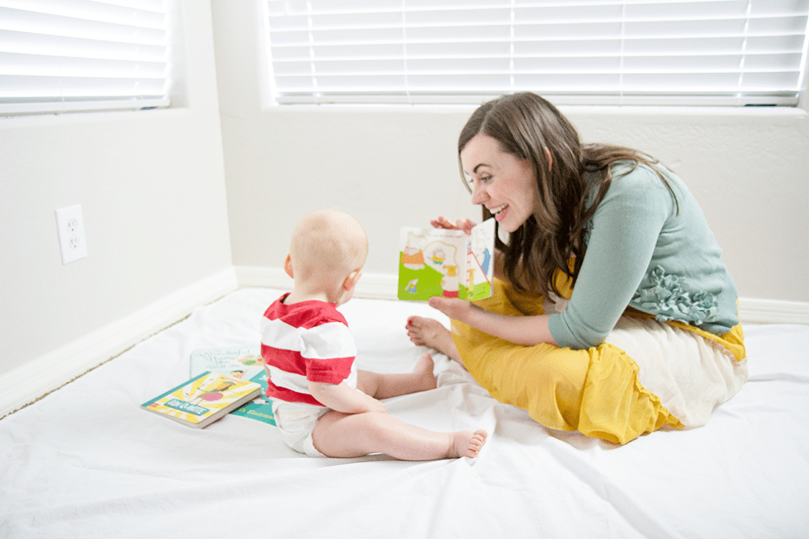 Mom reading to baby. 