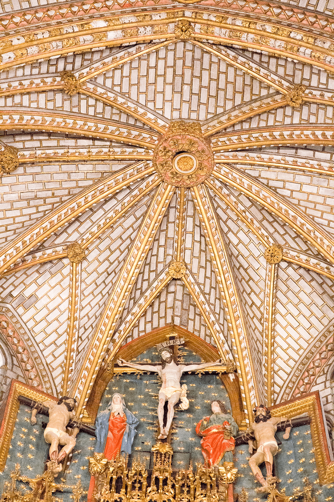 A detailed look at the ceiling architecture of the Toledo Cathedral in Toledo Spain. 