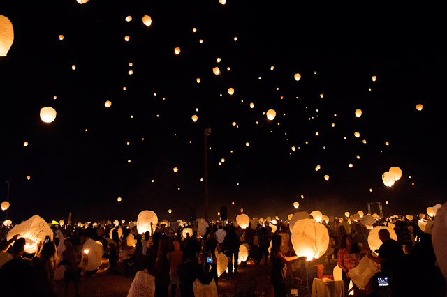 Lanterns set off in the night sky. 