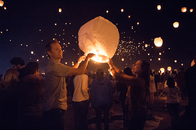 Lighting lanterns at the lantern festival. 