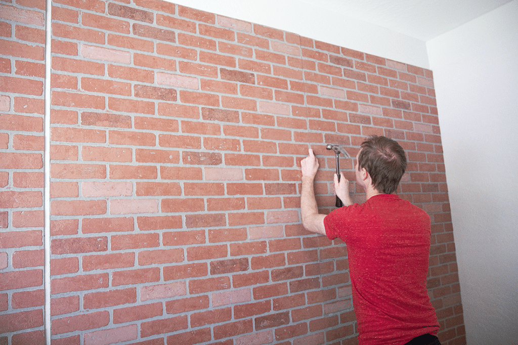 Faux brick wall panel installation