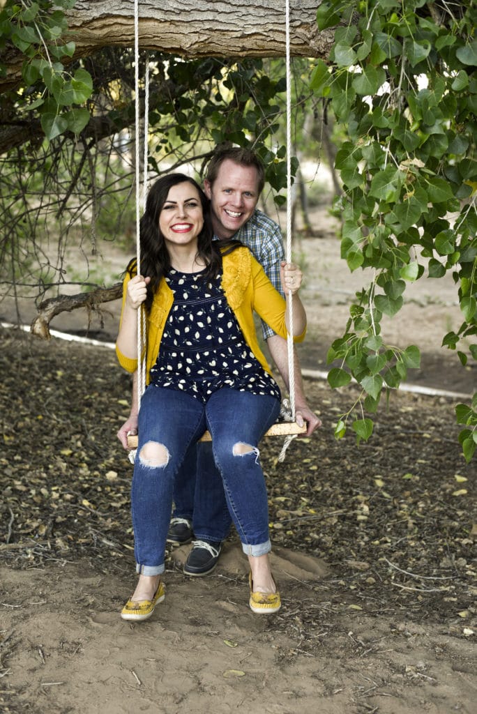 Cute couple on a swing photo. 