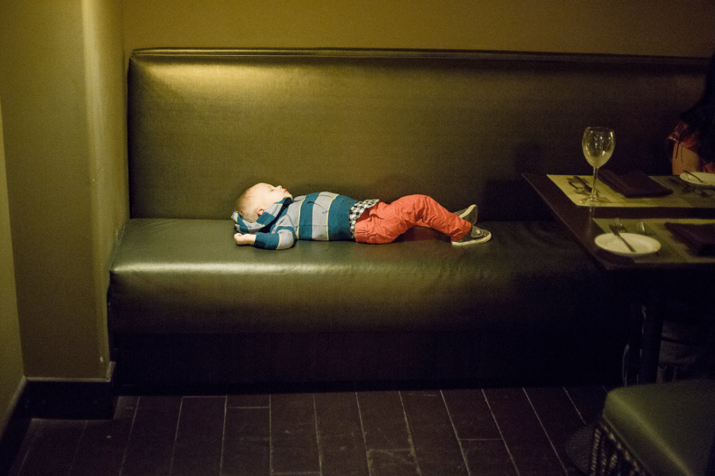 Exhausted toddler worn out in Rocky Point. 