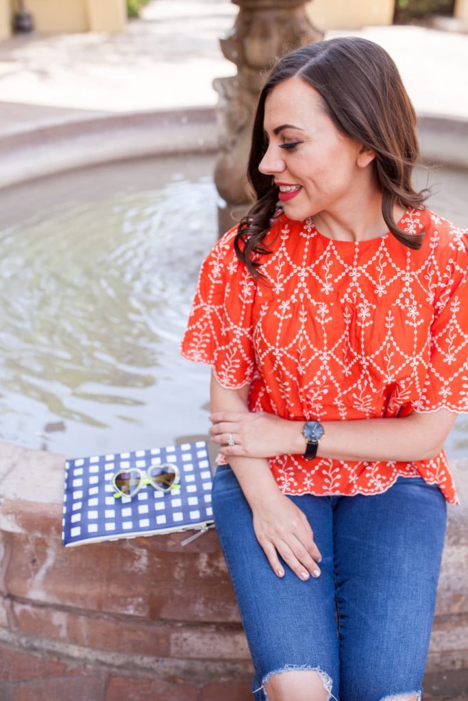 Women sitting by a fountain reflecting on miscarriage. 