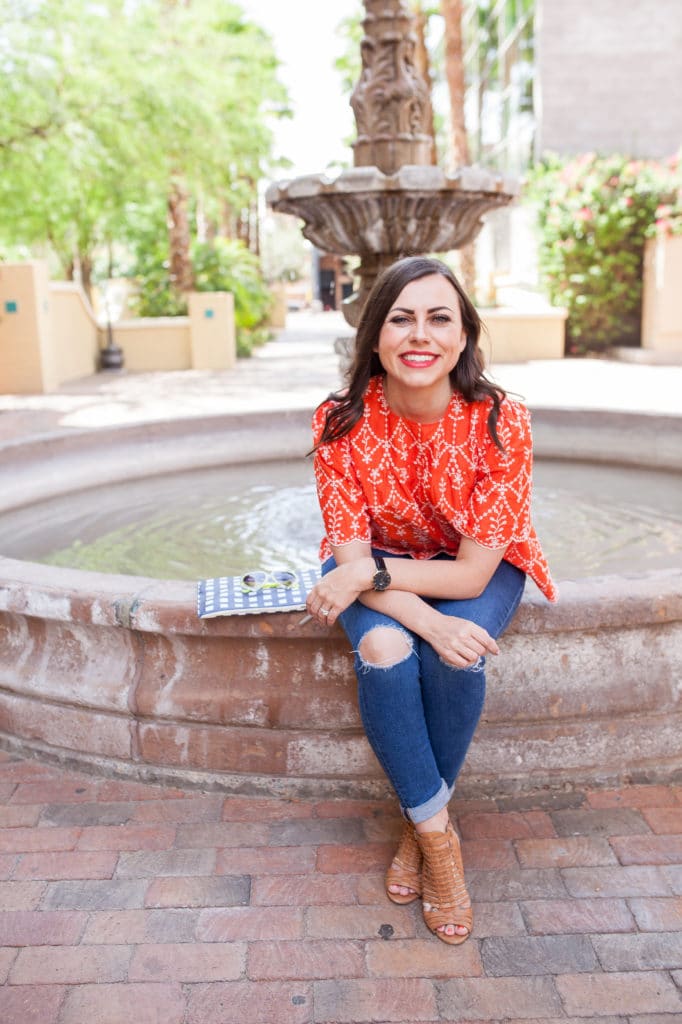 Women sitting by a fountain reflecting on miscarriage. 