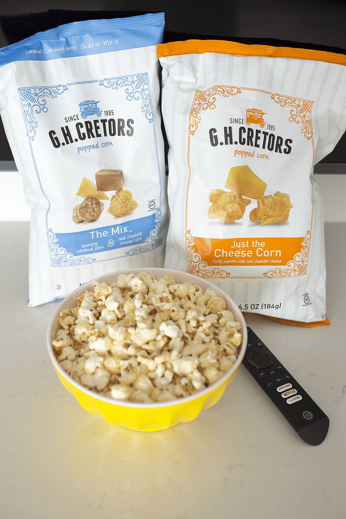 Popcorn and movies for a movie date night at home. 