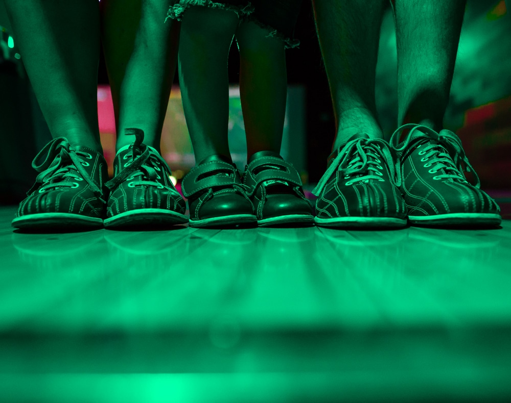 Family going bumper bowling. 