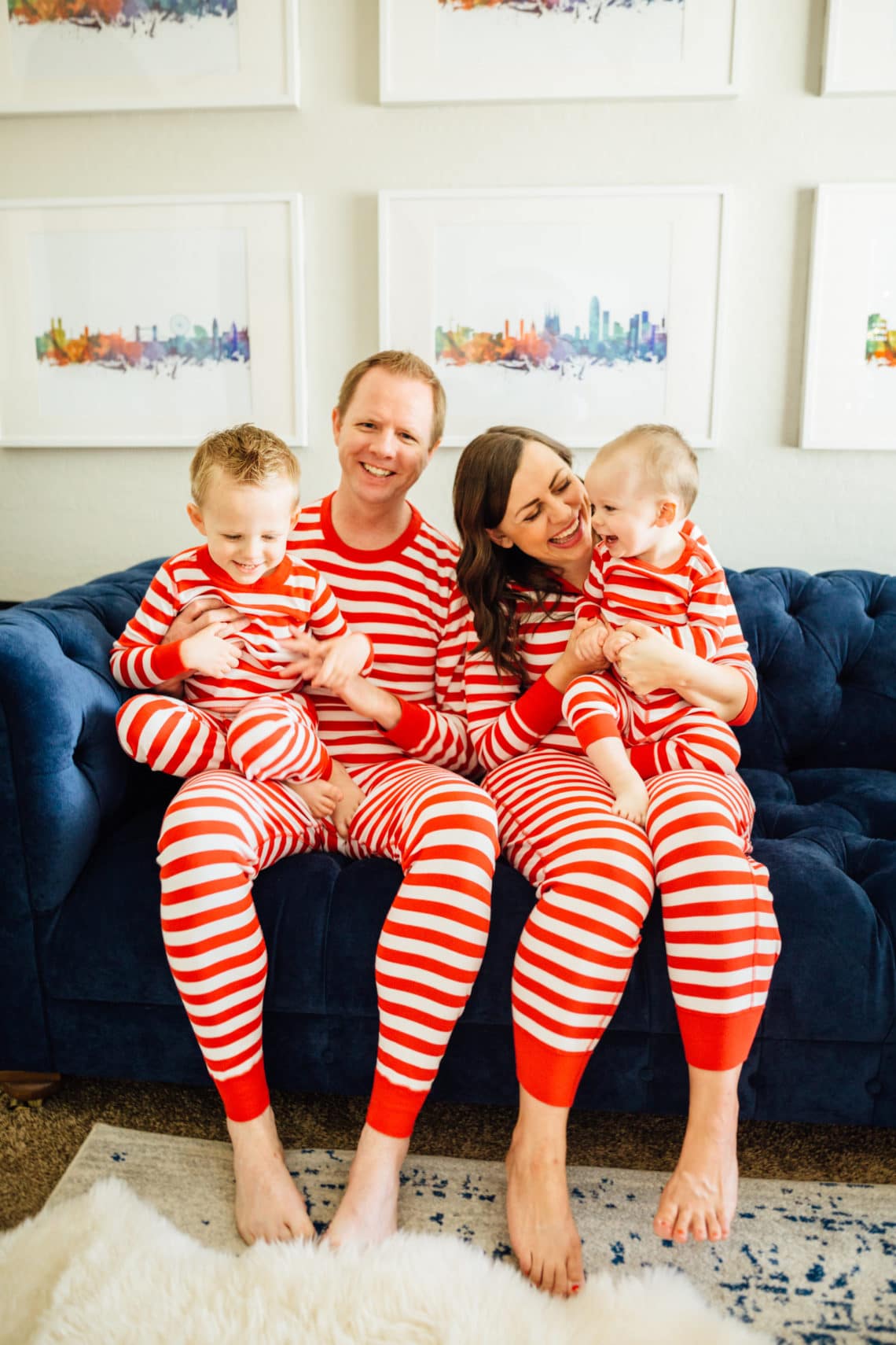 Family wearing striped Family Christmas Pajamas. 