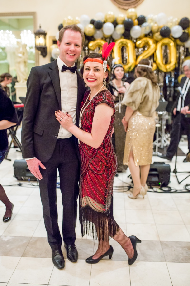 Couple dressed for a 1920s themed party. 