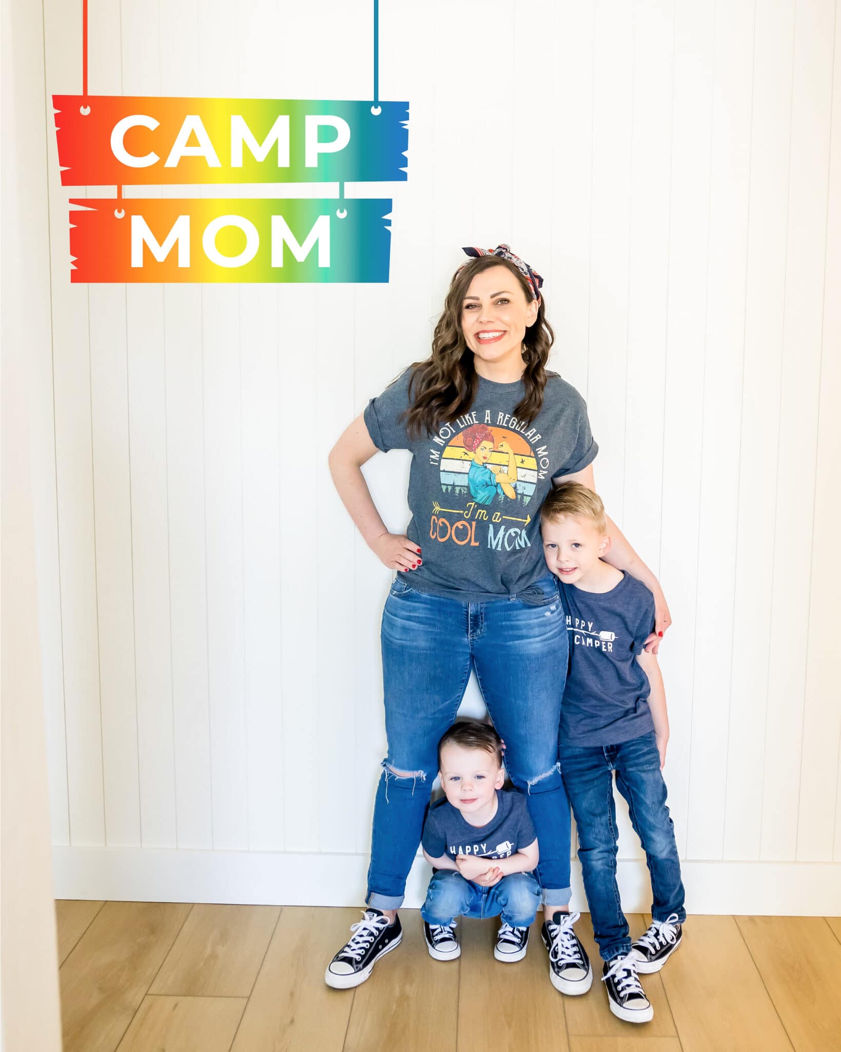 Mom with kids in front of a Fun Summer Camp Ideas at Home sign. 