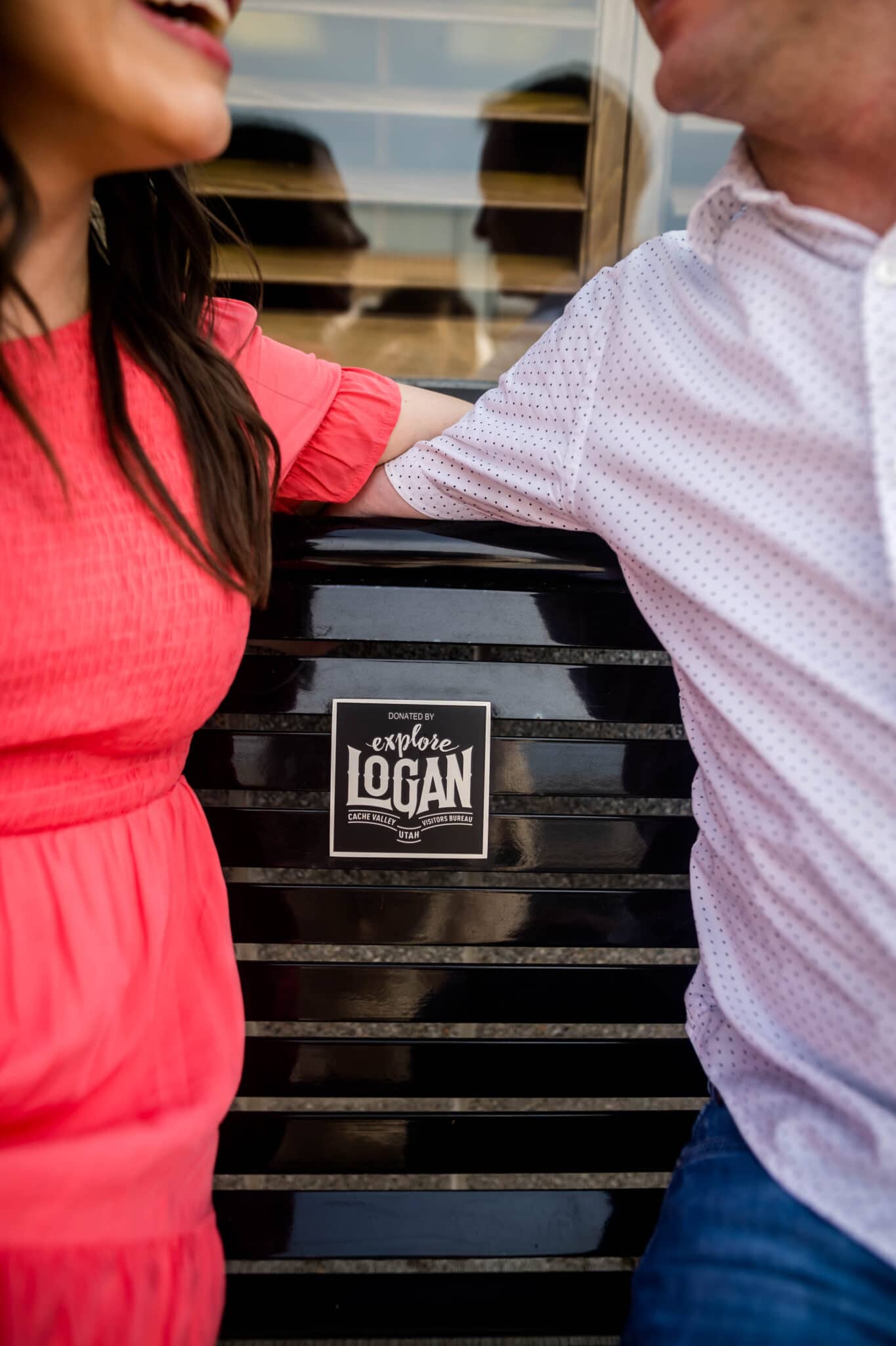 Couple sitting on a bench planning Date Ideas in Logan Utah. 