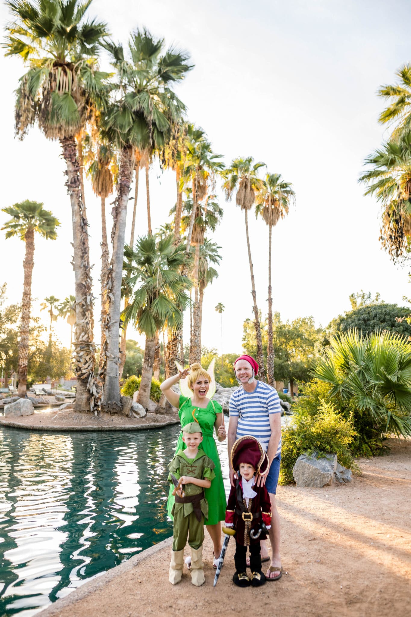 A cute Peter Pan Halloween Costume with a family dressed as Tinkerbelle, Peter Pan, Captain Hook, and Mr. Smee. 