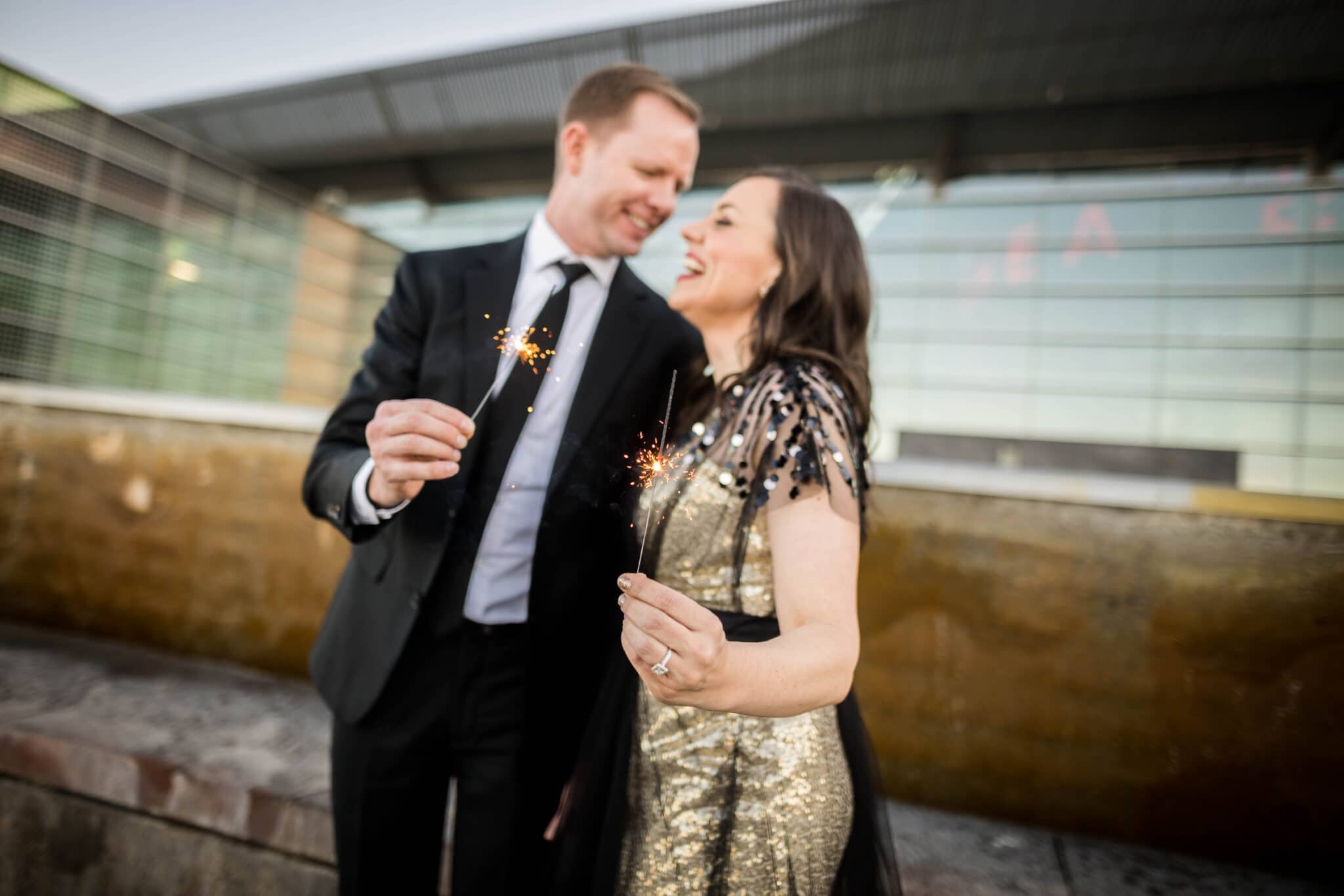 New Year's Date Ideas with a couple holding sparklers. 