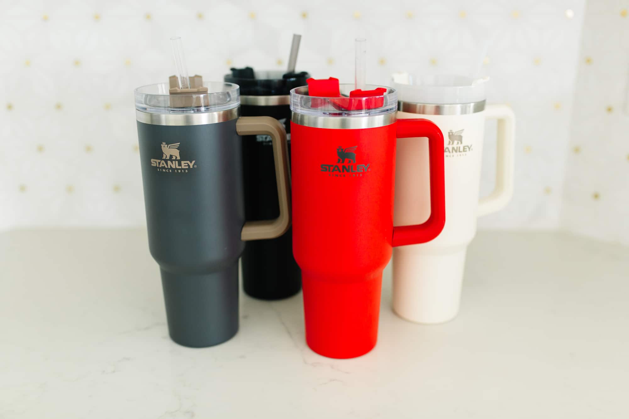 Stanley Tumbler With Handle on a white kitchen counter. 