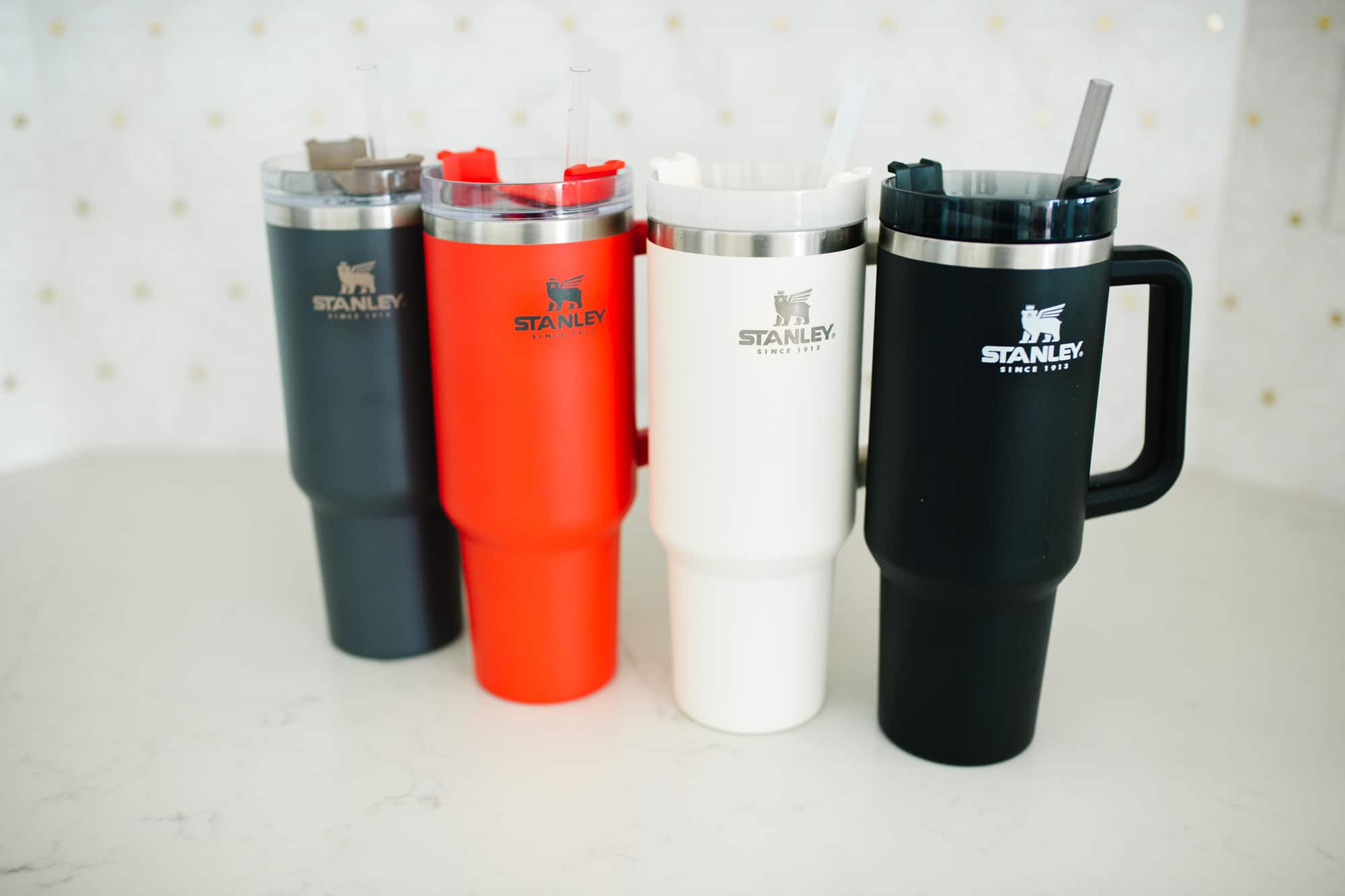 Stanley Tumbler With Handle color options shown in a row. 