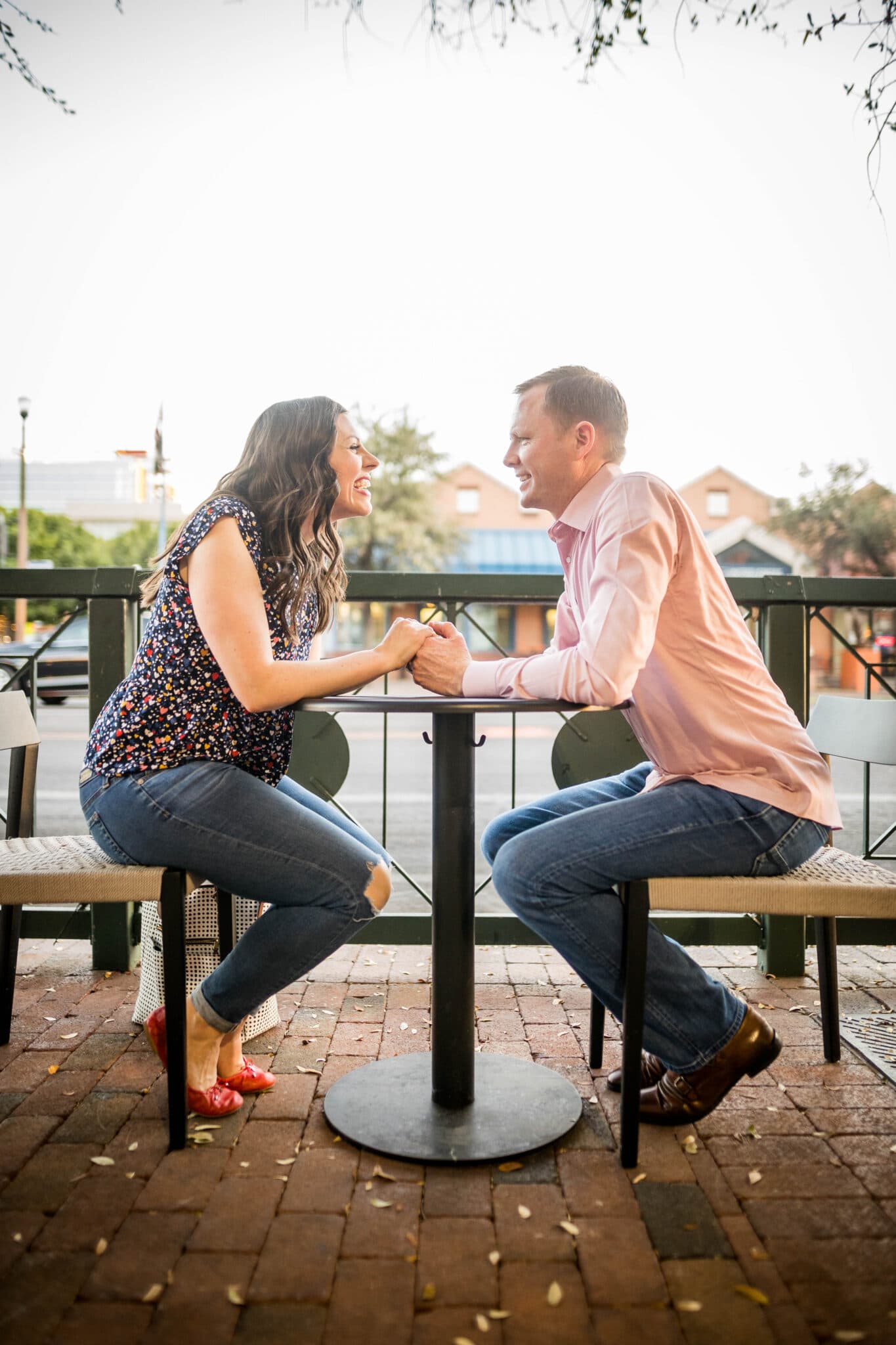 couple out on a patio for a dinner date using Would you rather dating questions. 