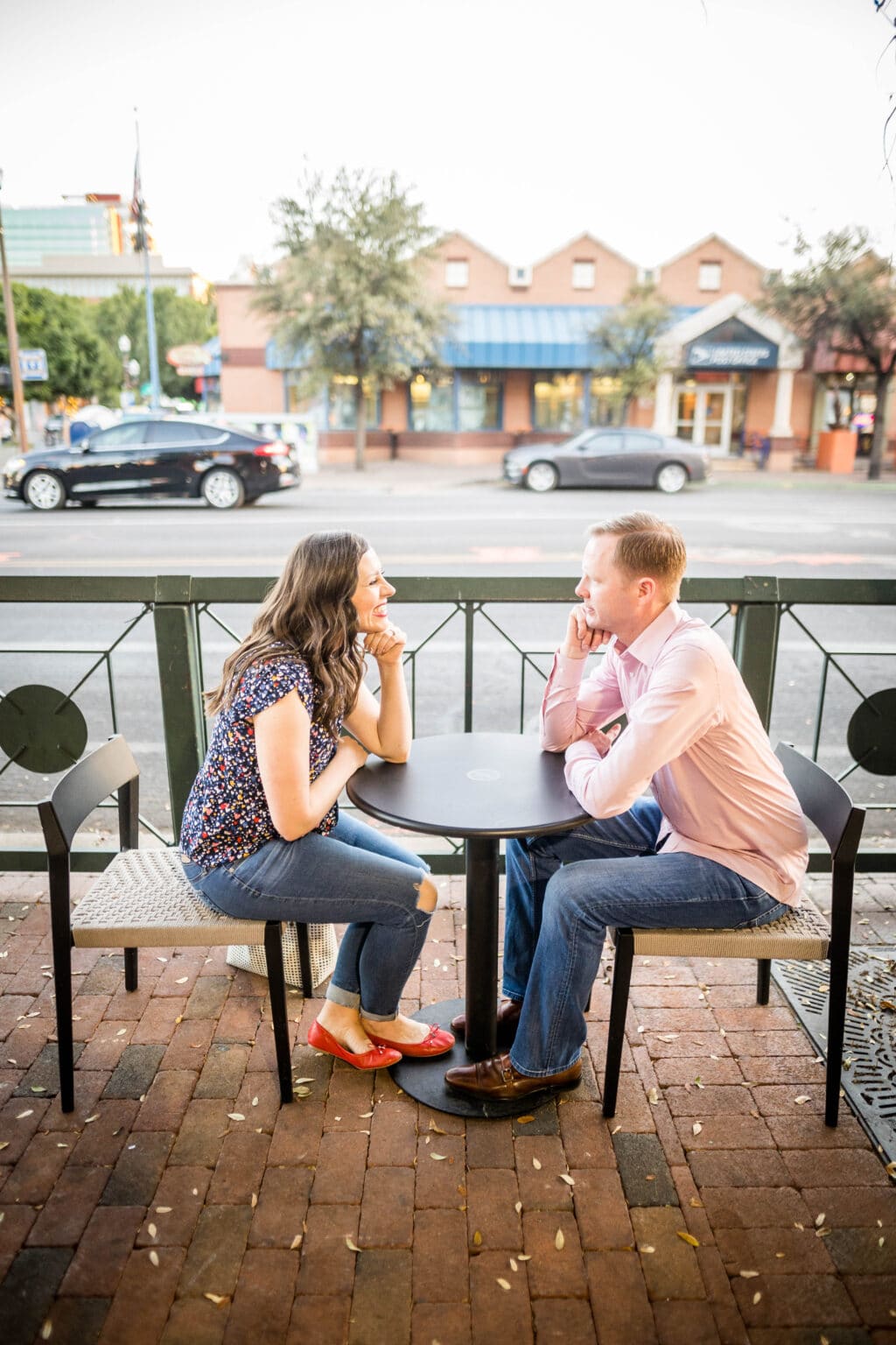 couple on a patio asking the 101 would you rather questions for couples free printable. 