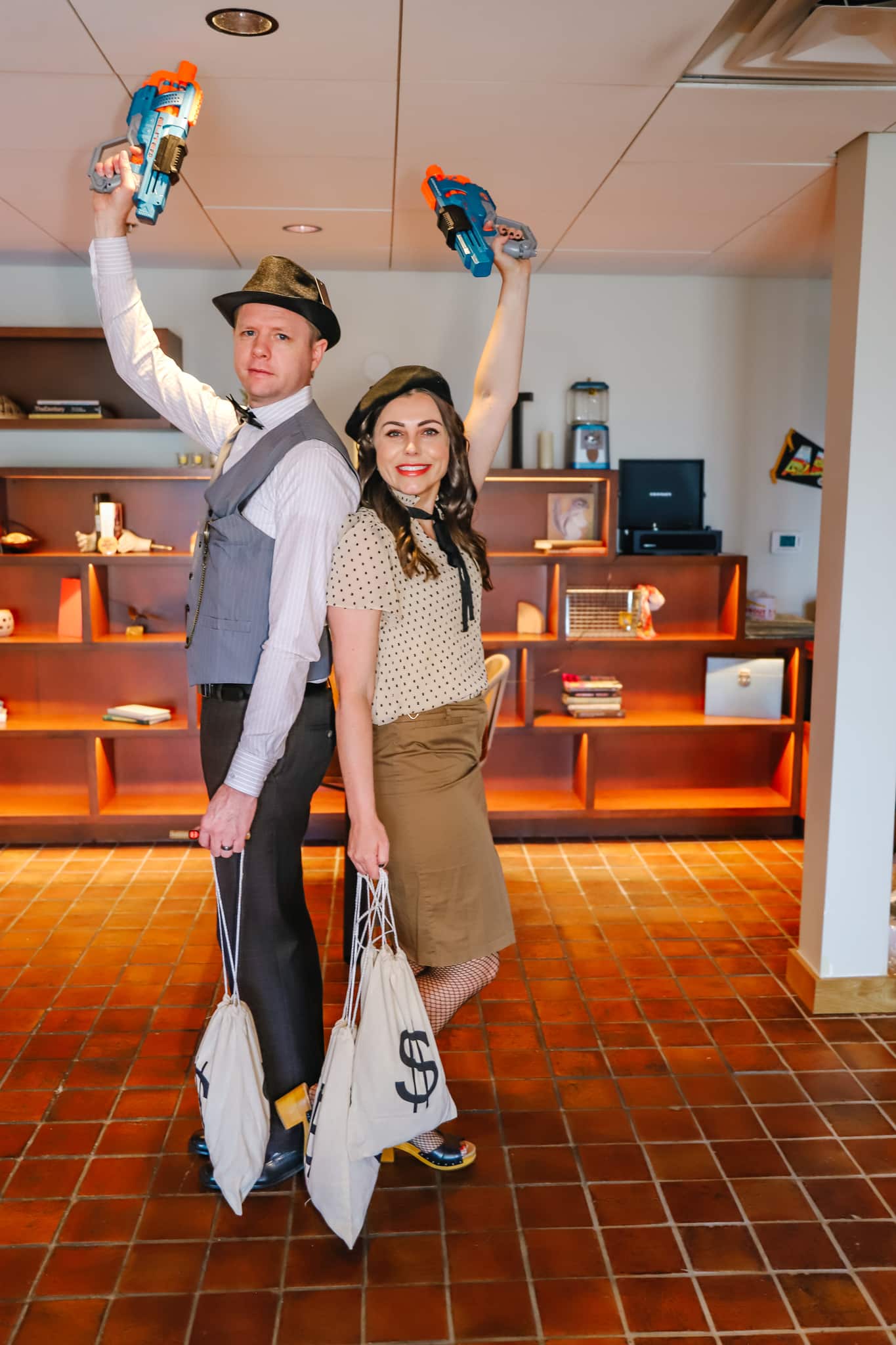 A couple modeling a great Bonnie and Clyde Halloween Costume. 