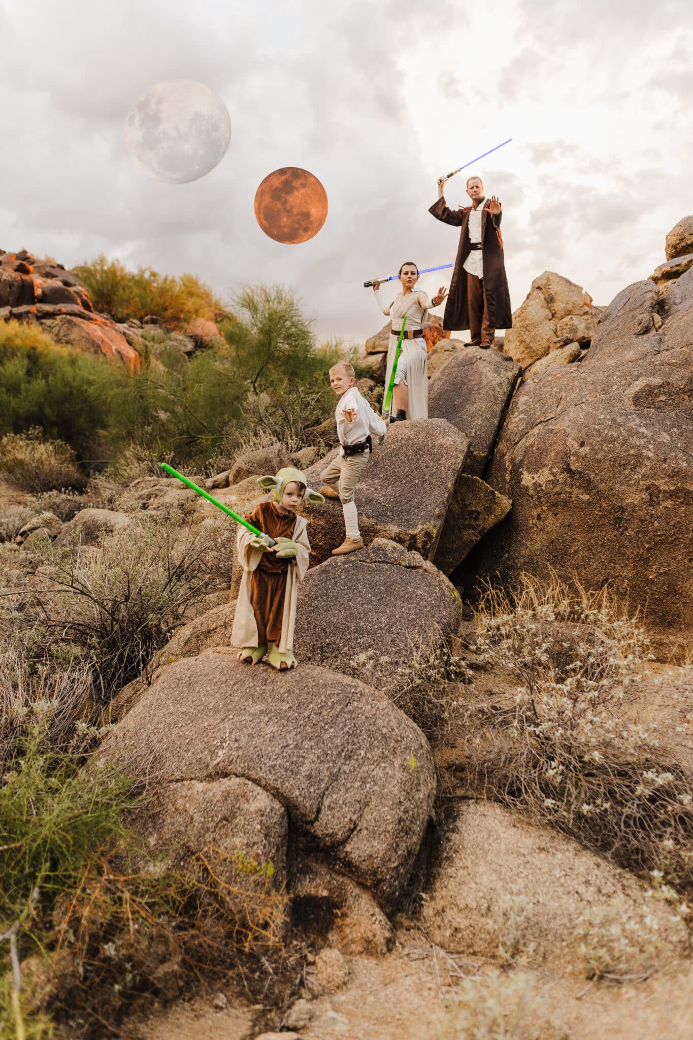 A family standing on rocks showing off Jedi Costumes for a Star Wars family costume idea. 