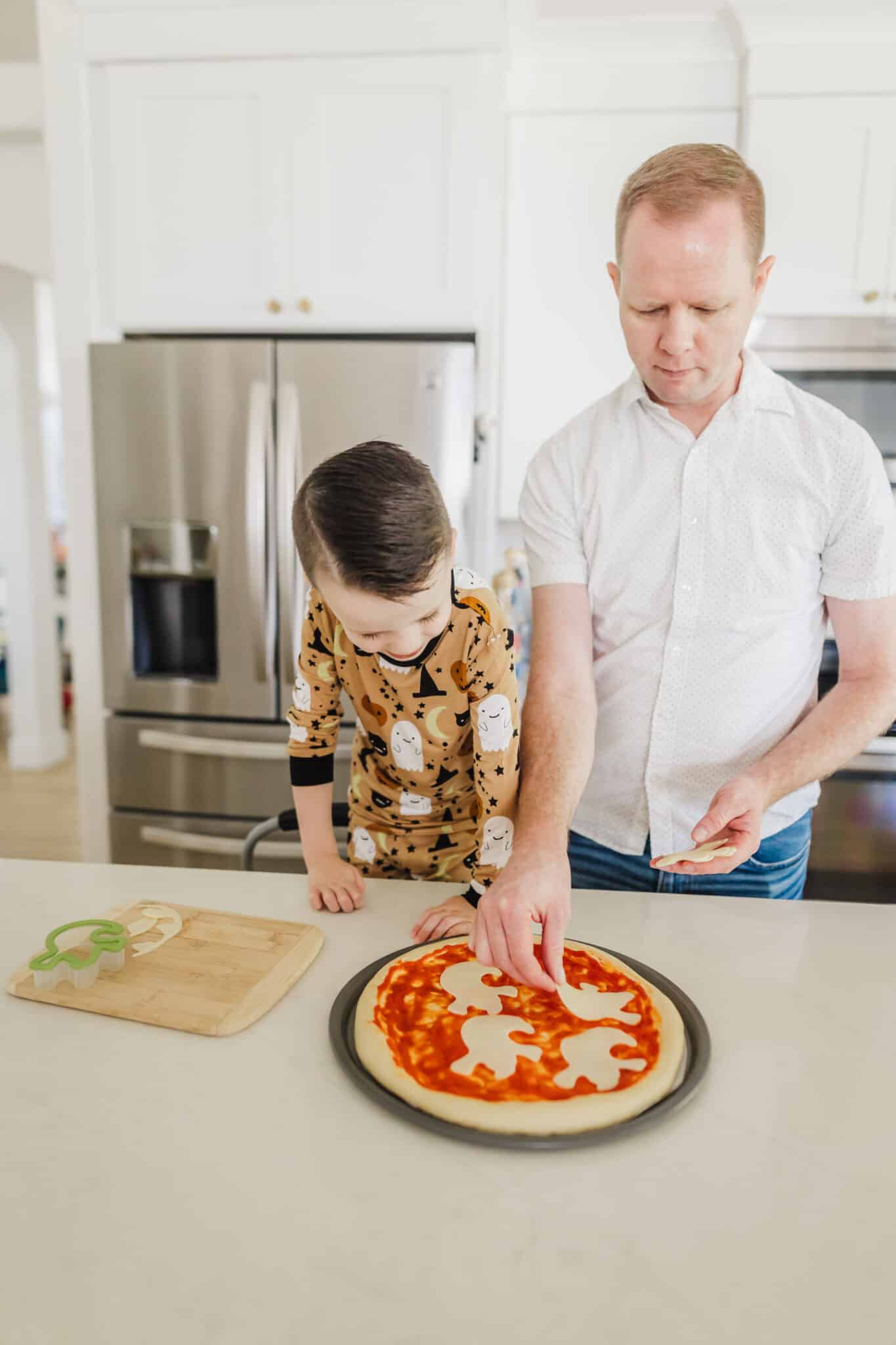 Making Halloween Pizza together.