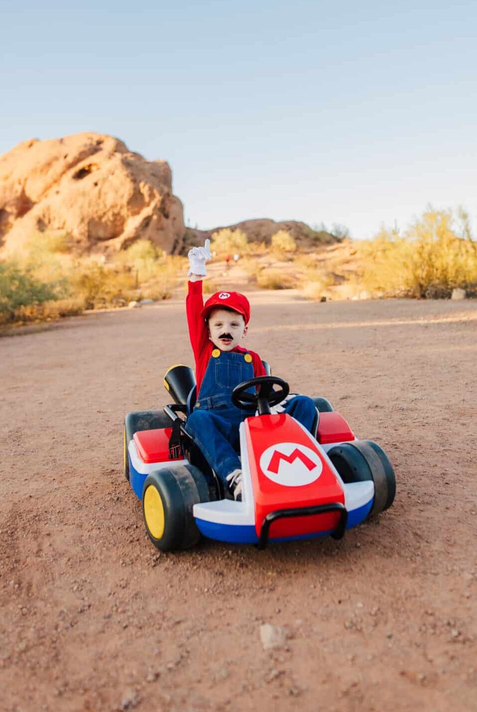 Mario Costume with kid in a Mario Kart. 