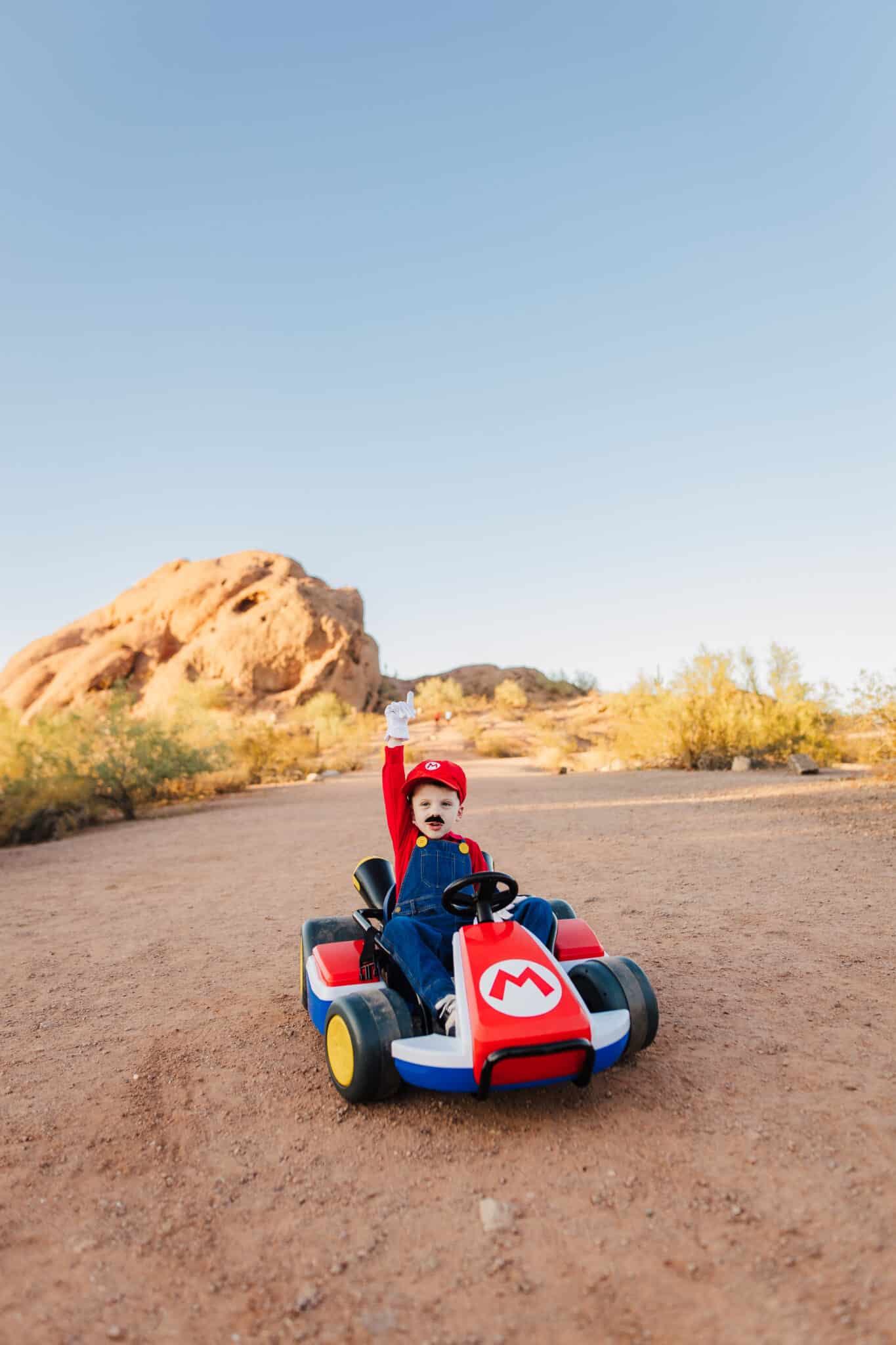 Mario Costume with kid in a Mario Kart. 