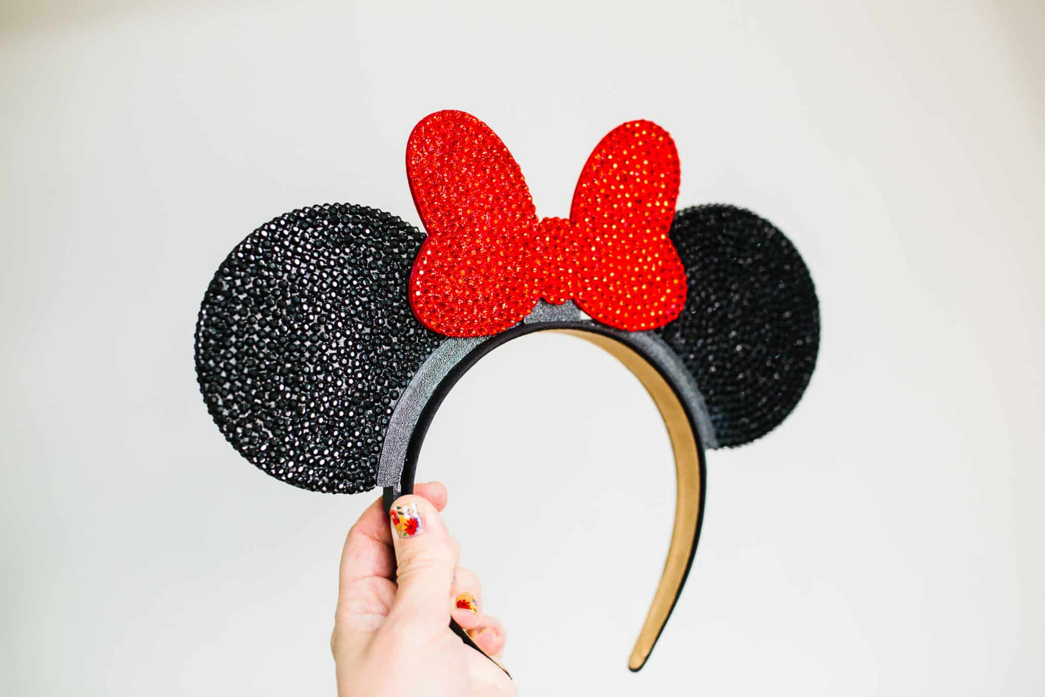 Sparkly Mickey ears with blinged out rhinestone Mickey ear base and bow. 