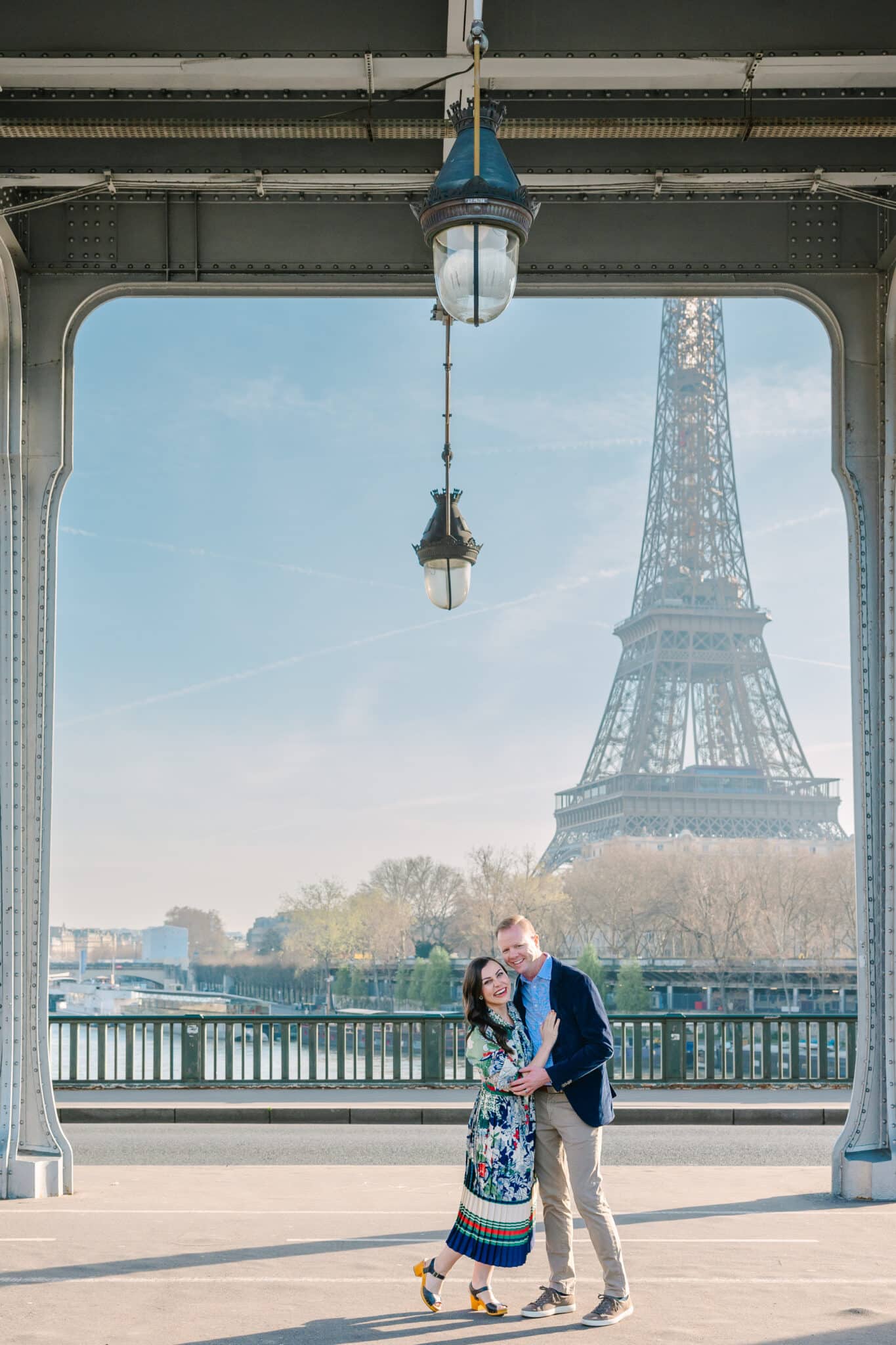 A couple photo shoot in Paris on the Eiffel Tower Bridge taken by Flytographer. 