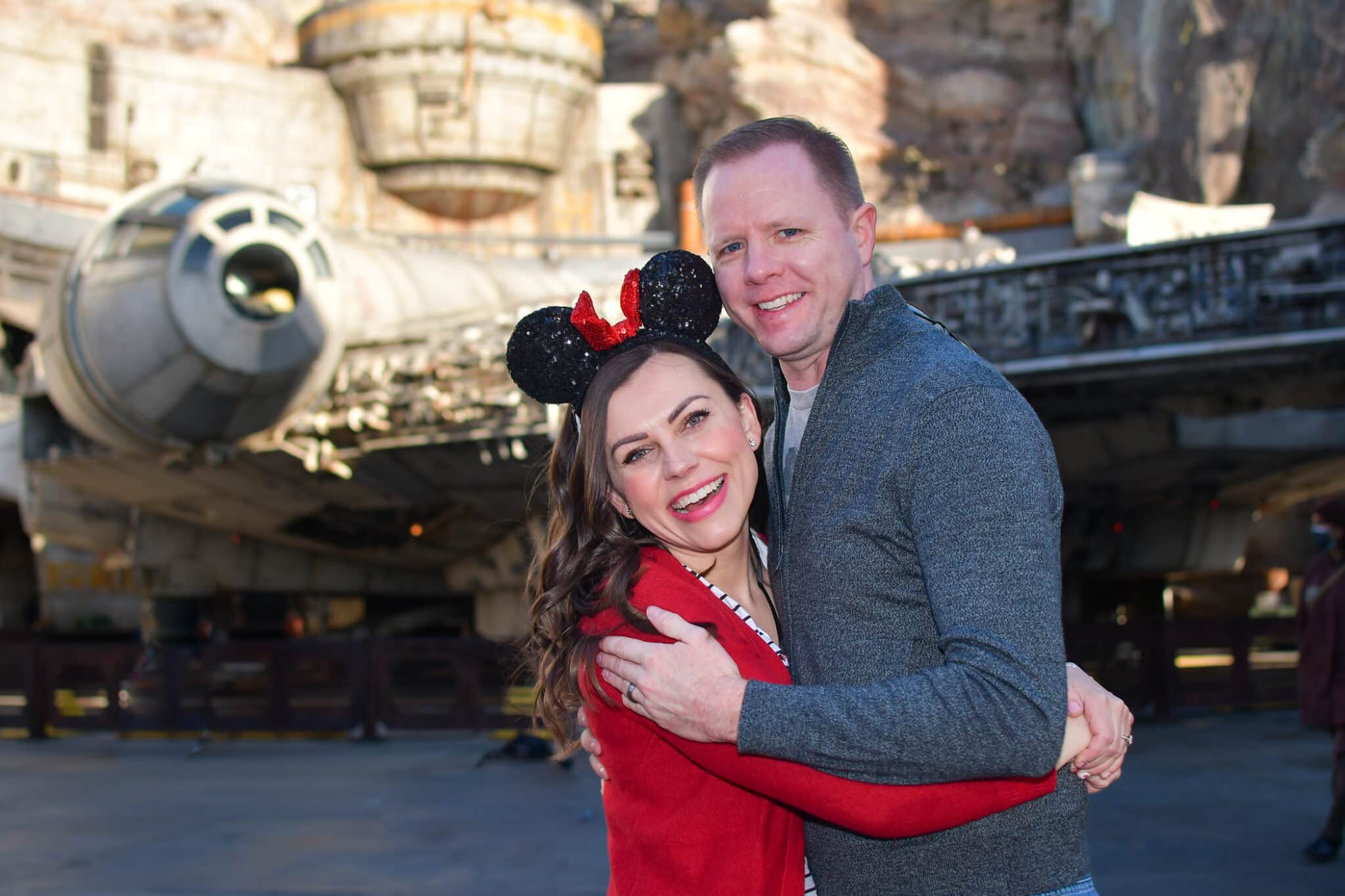 Couple showing What to wear to Disneyland in the winter. 