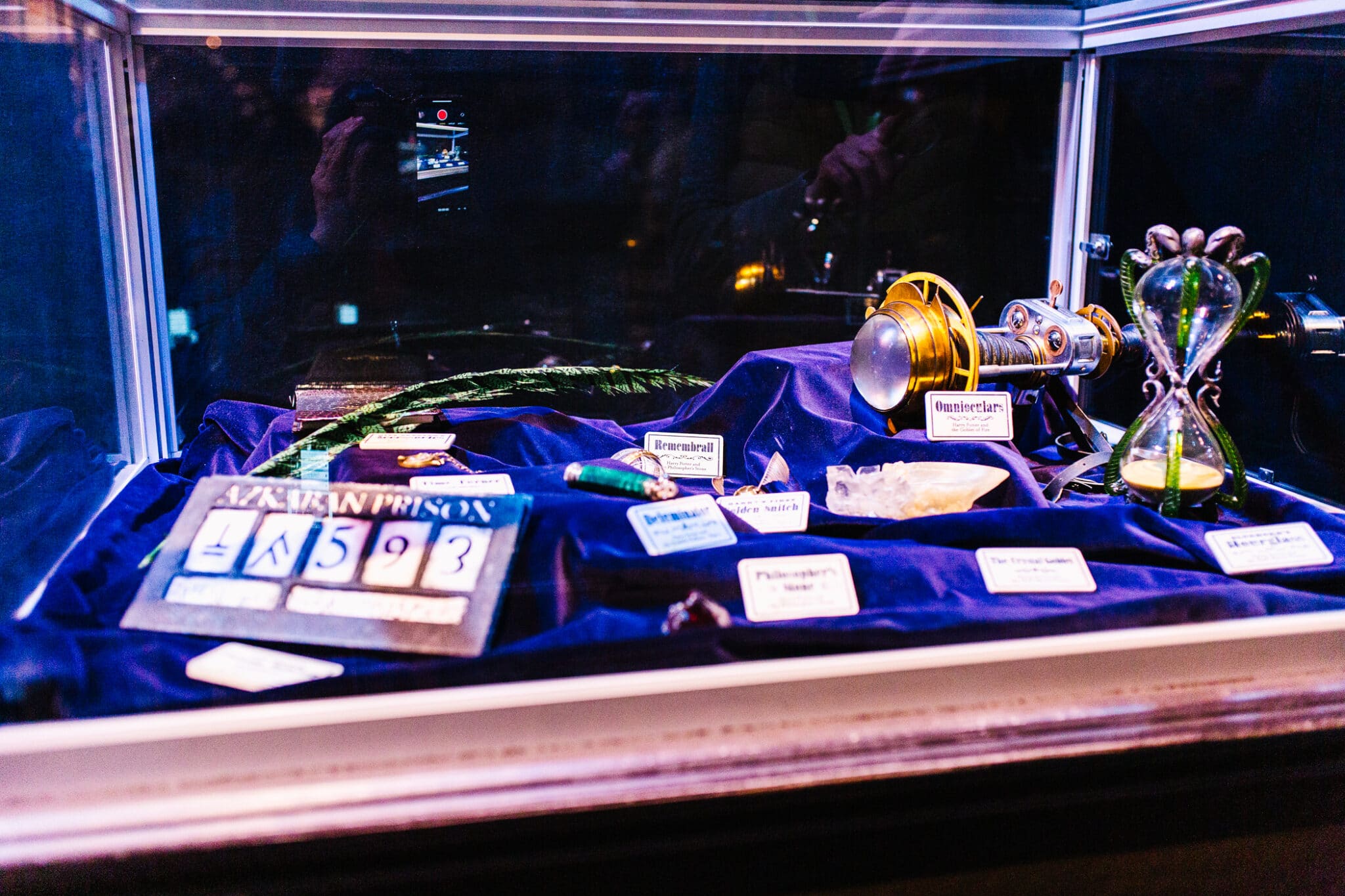 Display case filled with Harry Potter movie props on display at the Harry Potter Studio Tour London. 