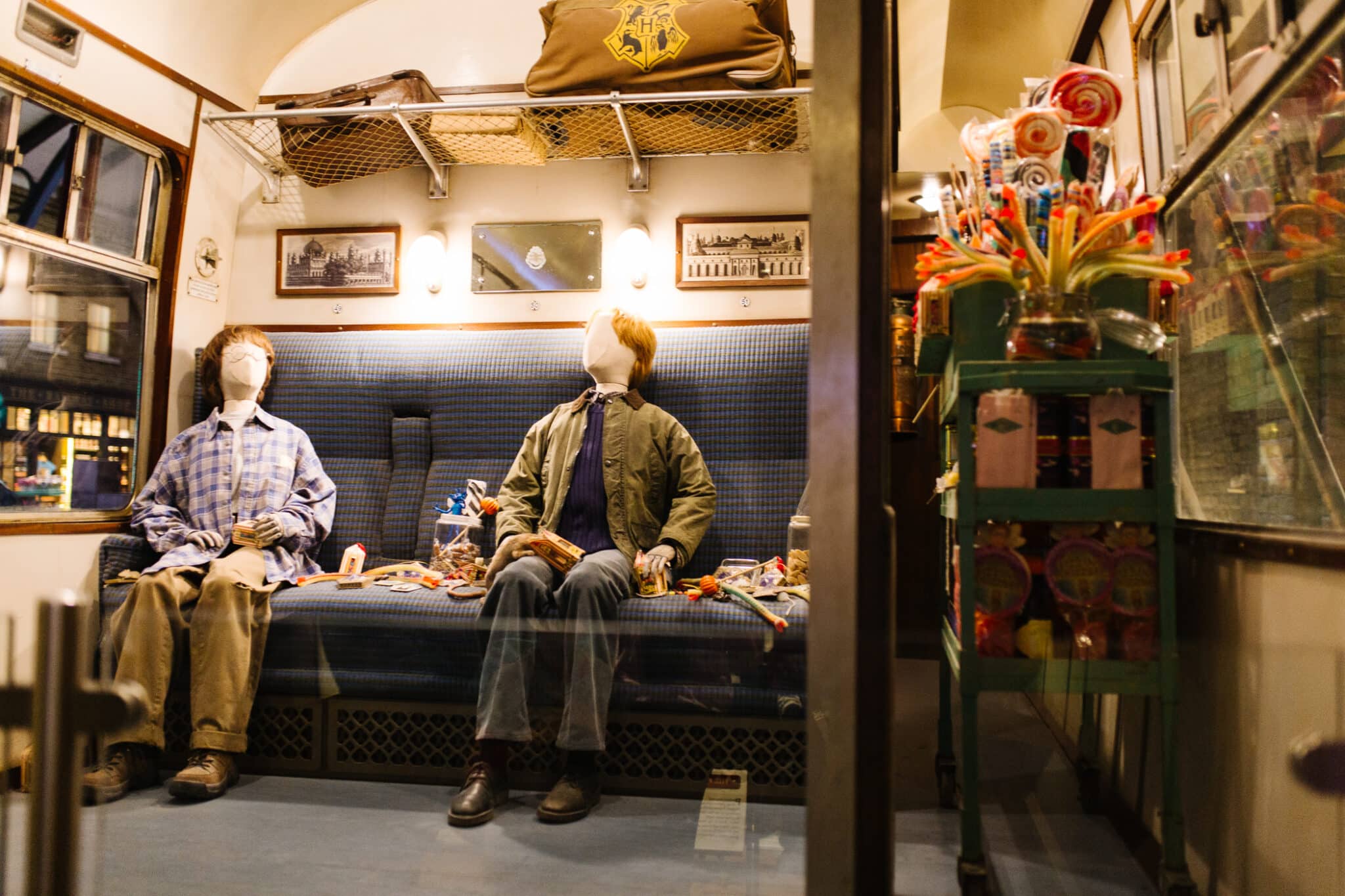 A look inside the train car from the first Harry Potter Movie with costumes and the treat trolley at The Making of Harry Potter Studio Tour London. 