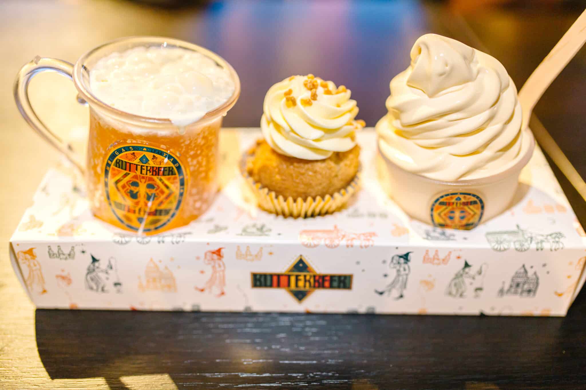 A tray with Butterbeer, A butterbeer cupcake, and butterbeer ice cream ad the Backlot Cafe at the Harry Potter Studio Tour London. 