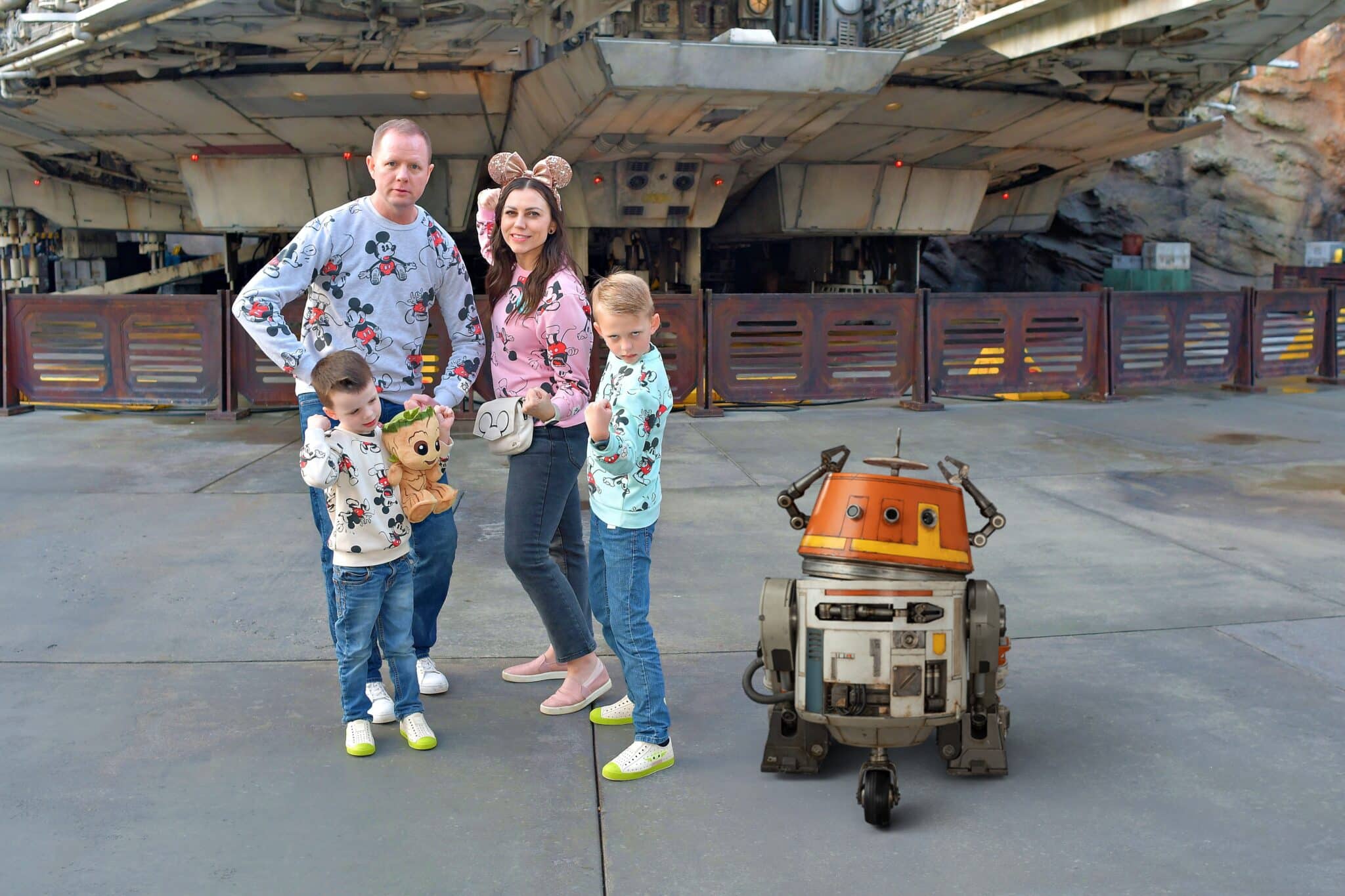 Disneyland tip- get a magic shot picture from a disneyland photographer. Here's a family with droid added in their photo. 