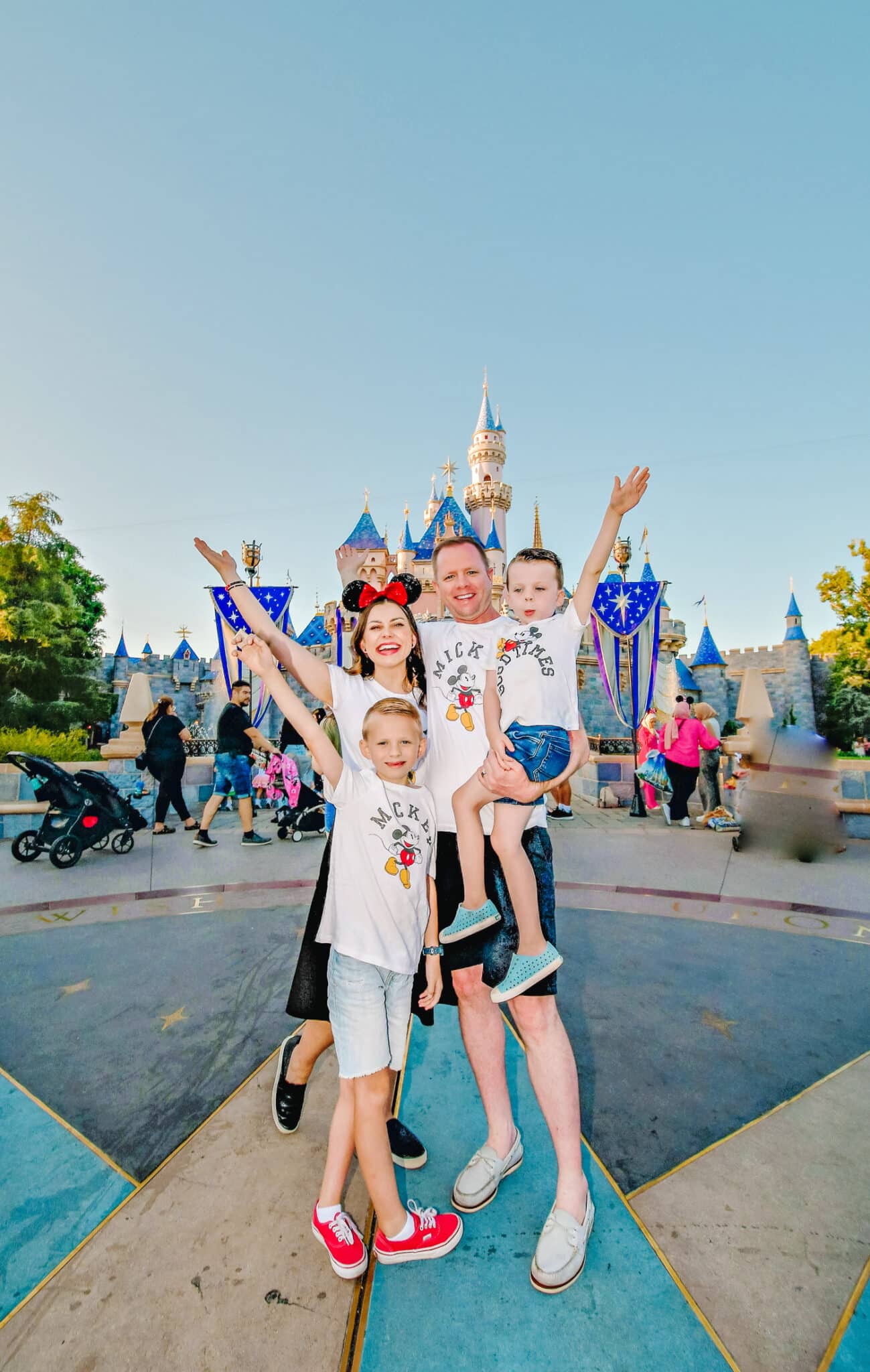 Disneyland tips from a family of Magic Key holders standing in front of the Disneyland castle. 