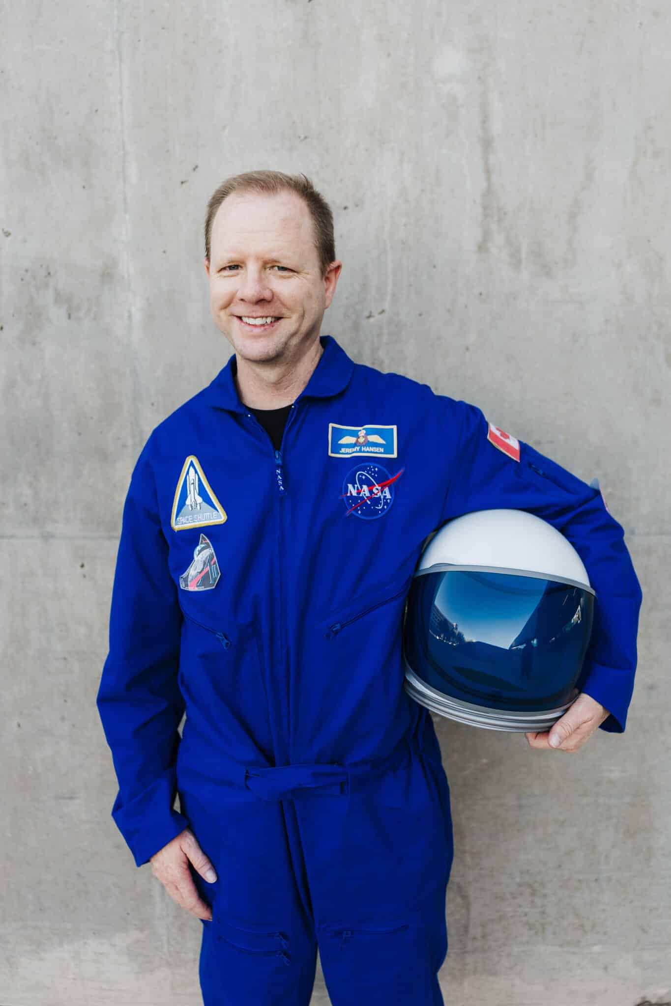 Astronaut Jeremy Hansen Halloween costume with a man in a blue flight suit and Canadian flag badge.