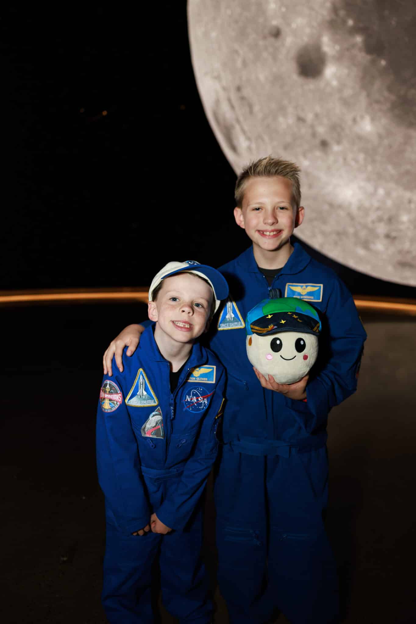 Kids astronaut costumes as the Artemis II crew.